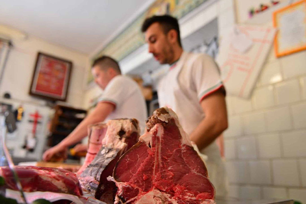 Vegan activists 'blackmail' butcher into displaying sign saying killing animals is 'violent and unjust'